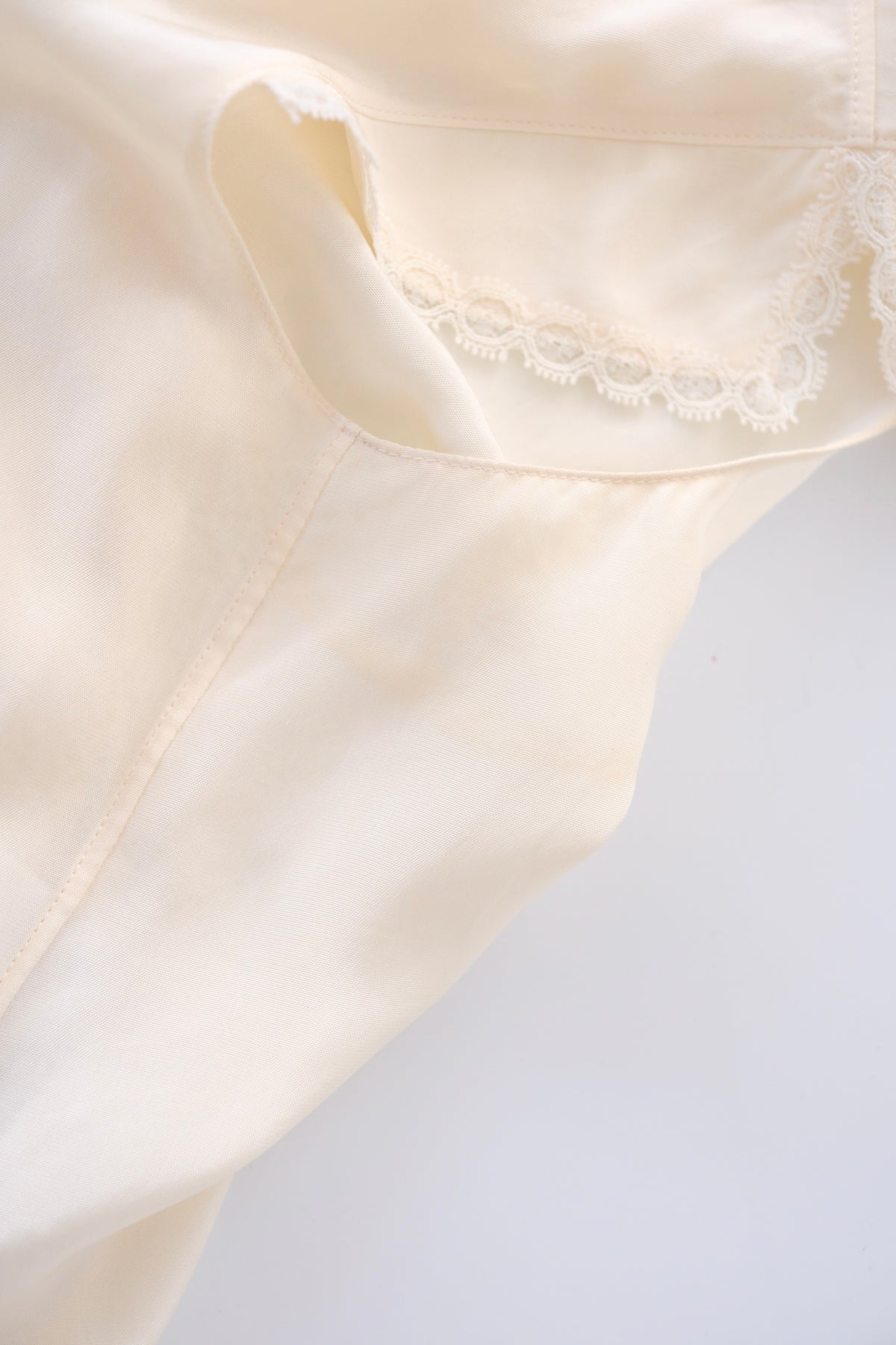 Prada semi-sheer cream zip-up blouse