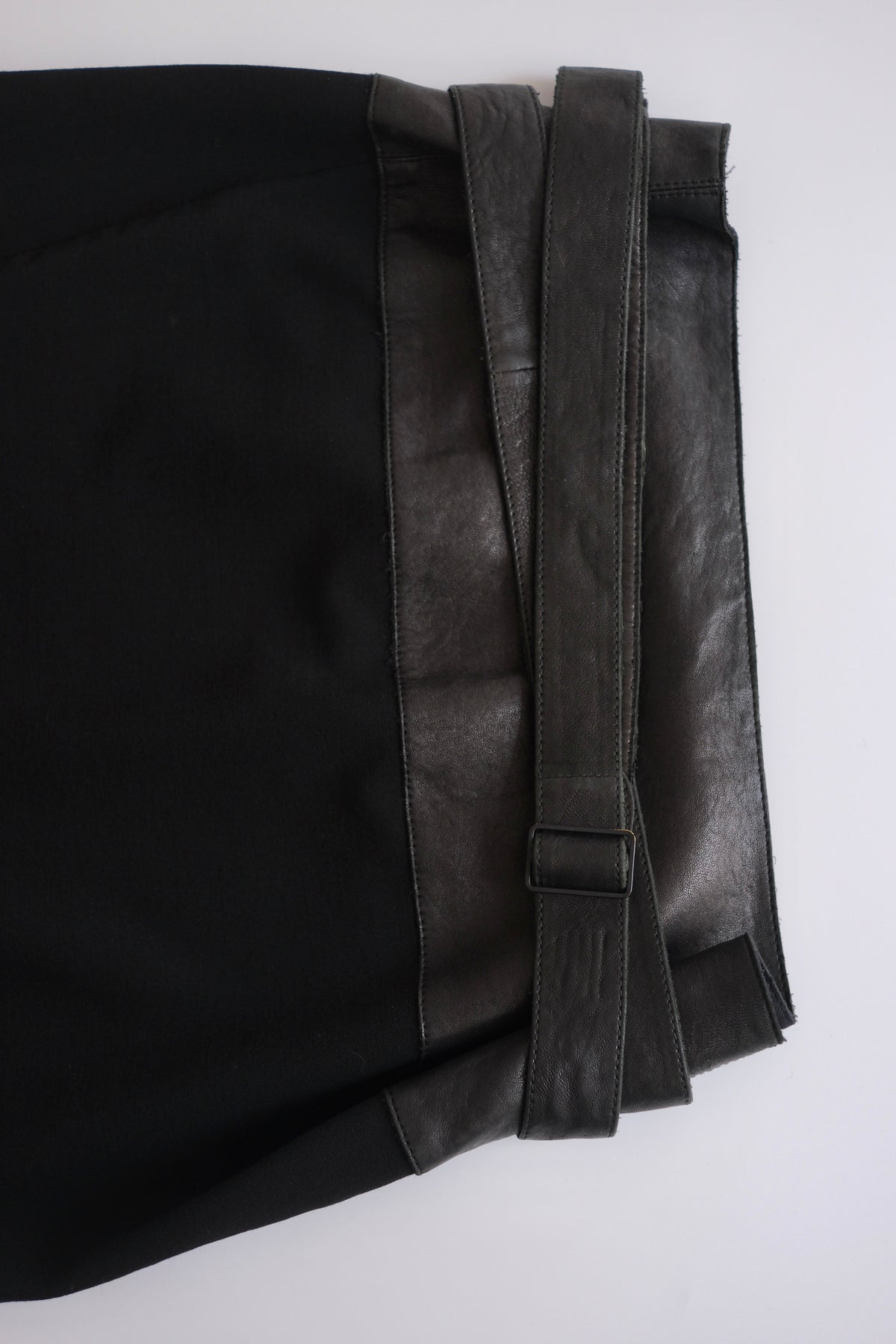 Donna Karan black wool and leather asymmetric knee-length wrap skirt